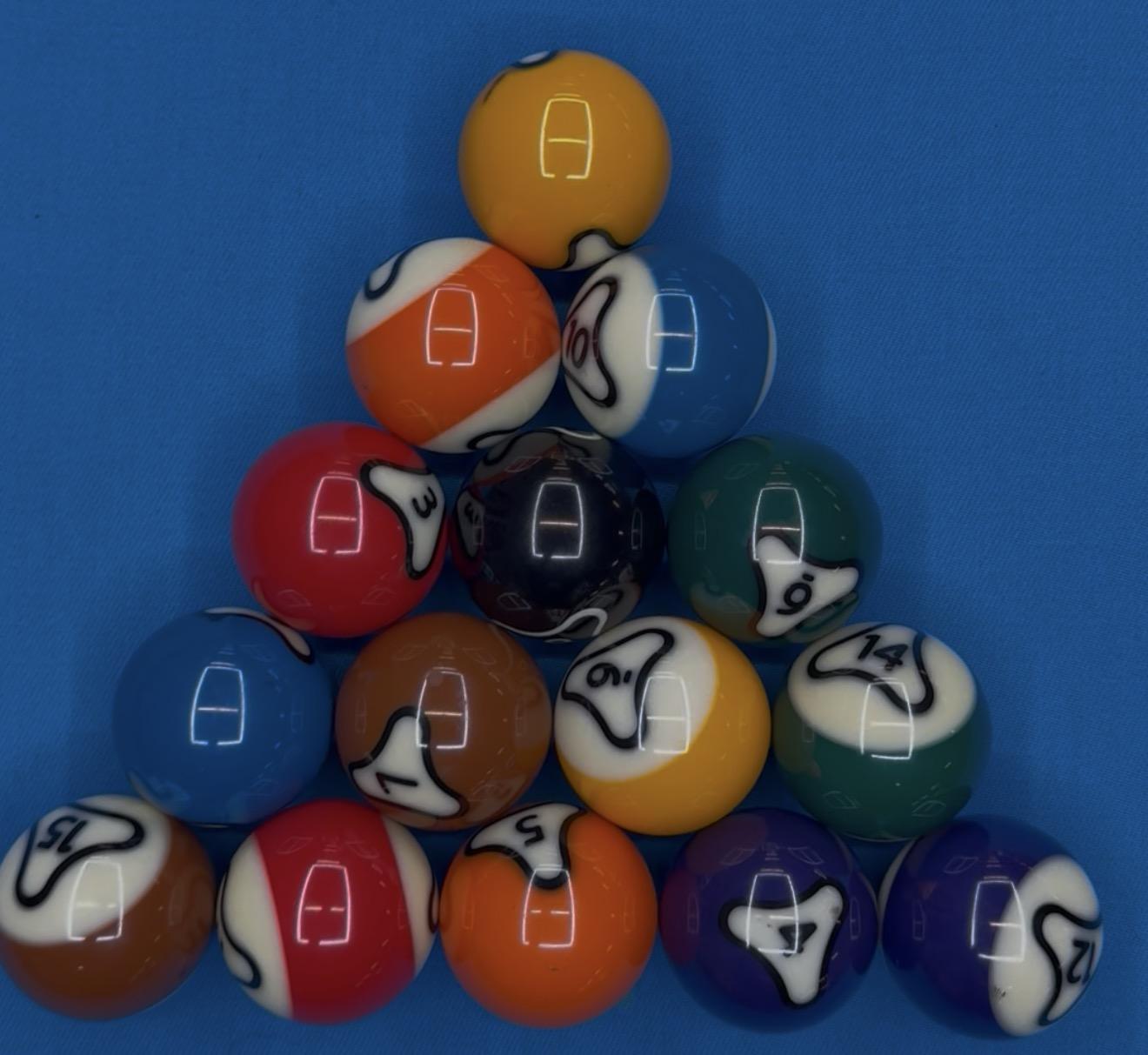 Racked set of Dynaspheres balls on blue felt