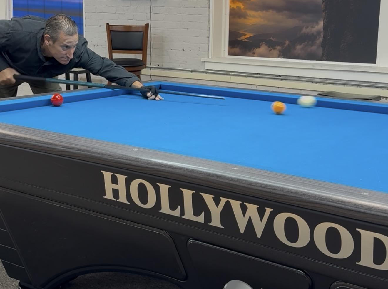 Player on a Hollywood carom table