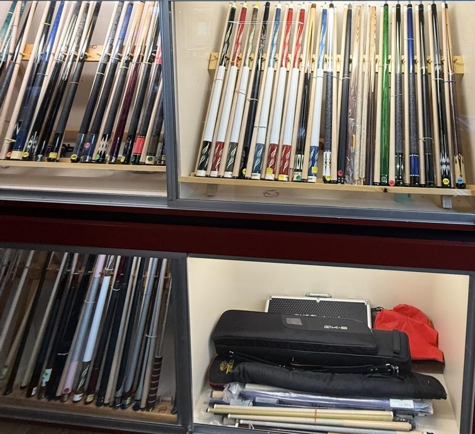 Cue display case and cases at the shop counter