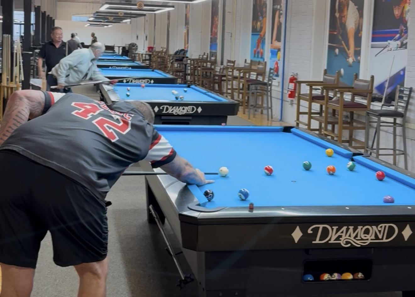 Player lining up a shot on a Diamond table